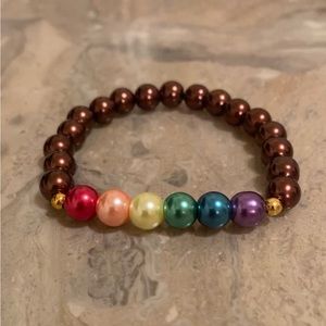 6 3/4 -7” wrist. Rainbow glass PRIDE brown bracelet: Double glued in bead knot.